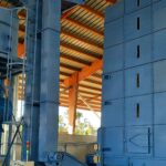 buffer tank for sawdust followed by a screw and bucket feeder for sawdust transport, control panel