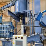 pellet production line, tank with a sawdust mixer above the beater mill, screw feeders for transporting sawdust to and from the