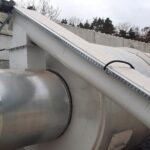 pour sawdust into the drying drum