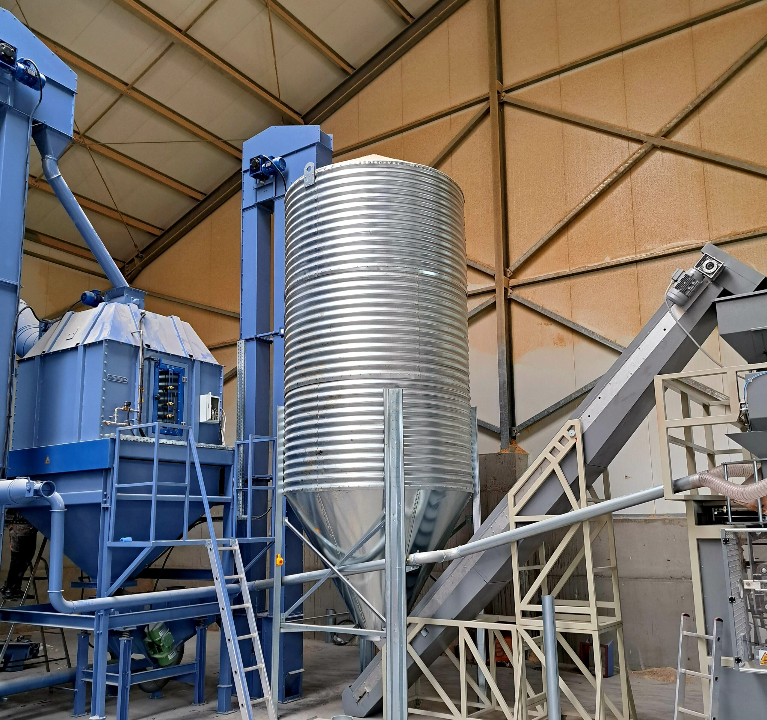 pellet production line, pellet cooler, pellet sifter, pellet silo, belt feeder for transporting pellets to the packaging machine
